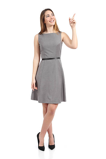 Full body of a standing woman pointing at side