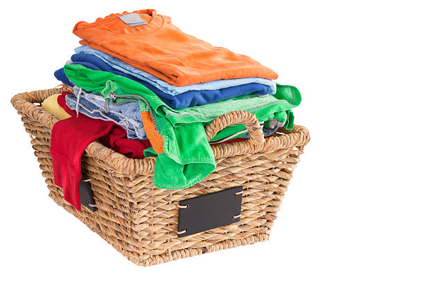 istock Clean washed fresh summer clothes in a basket 487220911
