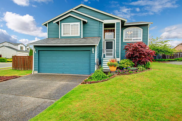 istock Small house with pretty flower bed. 487220983