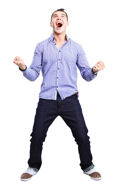 istock Excited handsome man with arms raised in success 487221053