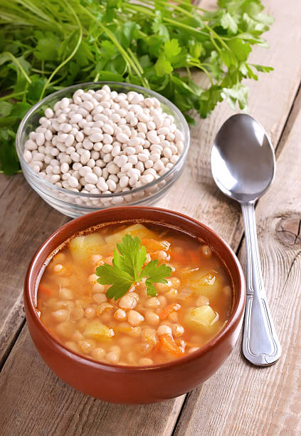 istock Bean soup on wooden table 487222331