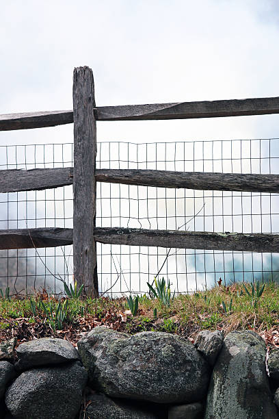 istock farm fence with looming sky 487222661