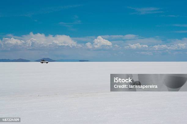 Vehicle Crossing The Desert Stock Photo - Download Image Now - Blue, Salar de Uyuni, Sky