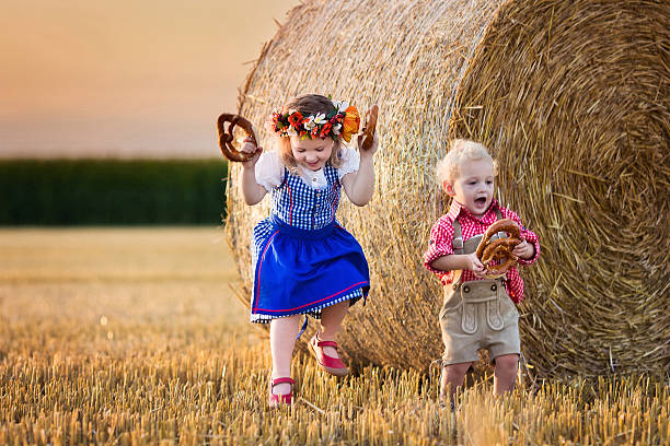 istock Kids playing in wheat field in Germany 487224430