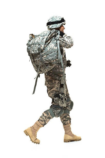 istock Smiling army man walking and looking away 487224598
