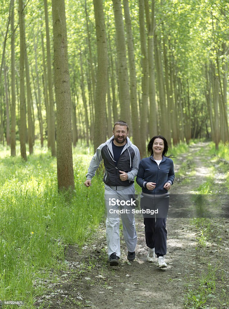 Middle-aged couple jogging. Middle-aged couple jogging. Feel free to see my similar photos. 40-44 Years Stock Photo
