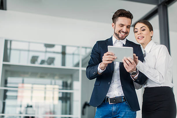 istock Young people with tablet in the office 487225576