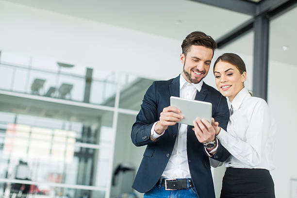 istock Young people with tablet in the office 487225590