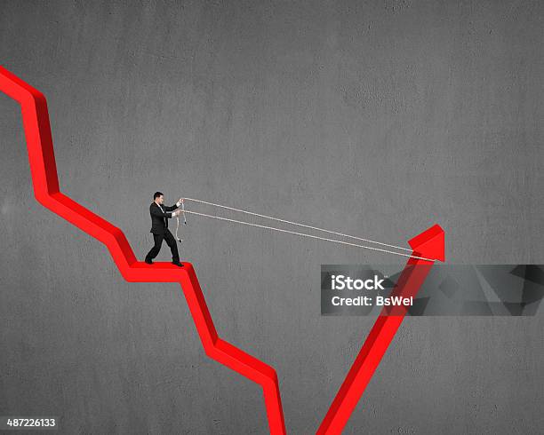 Man Pulling Up Going Down Red Arrow Stock Photo - Download Image Now ...