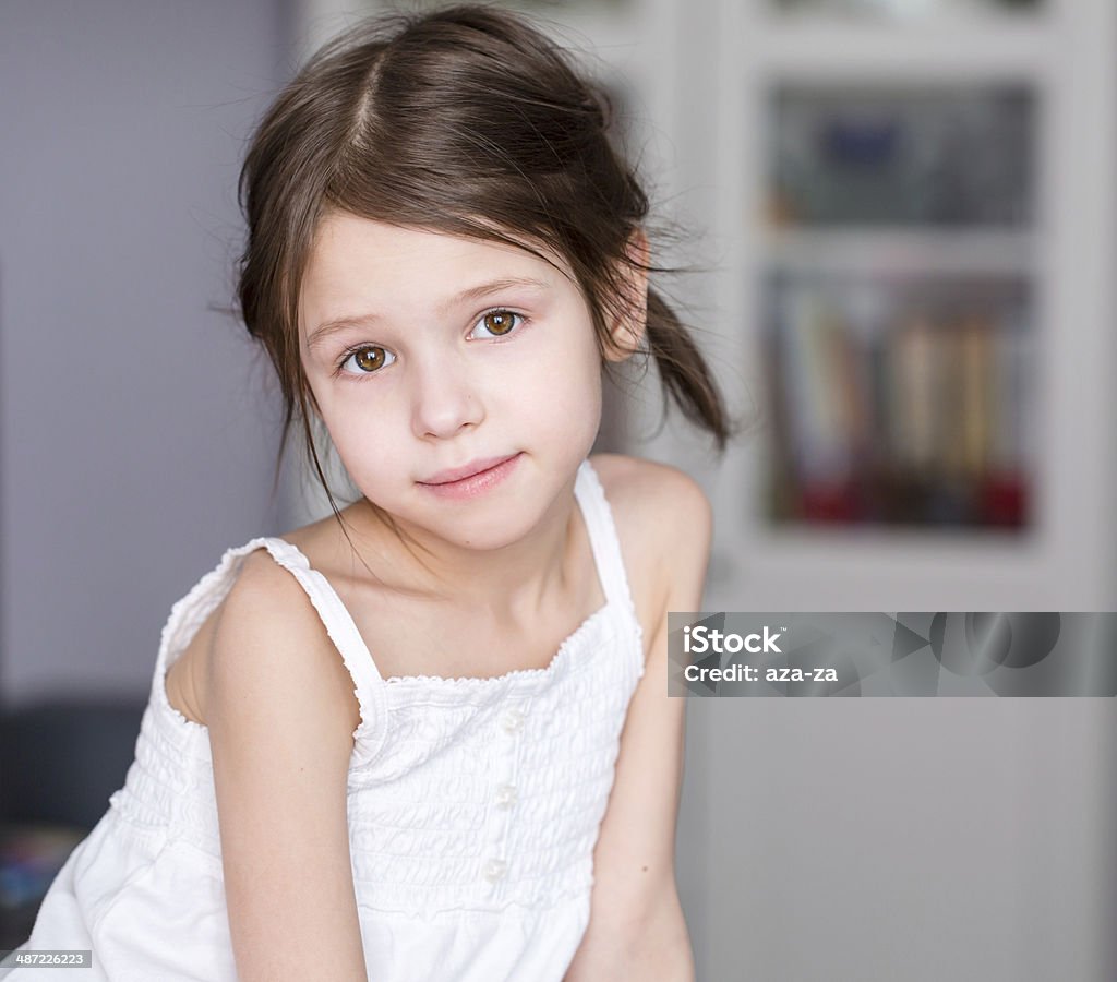 Portrait of smiling adorable preschooler girl at home Affectionate Stock Photo