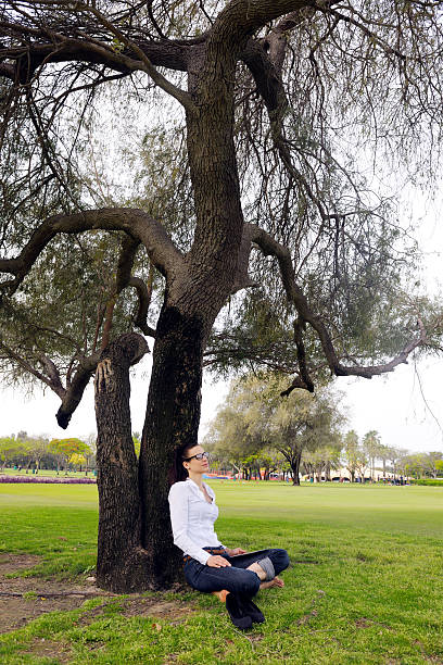 istock Beautiful young woman with  tablet in park 487226835