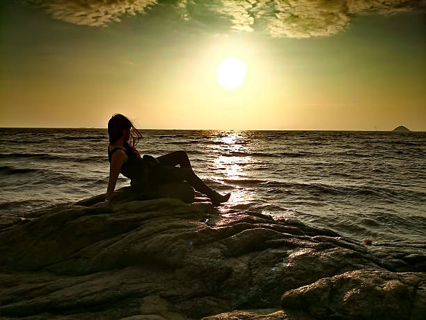 istock Girl on the Coast at Sunset 487228760