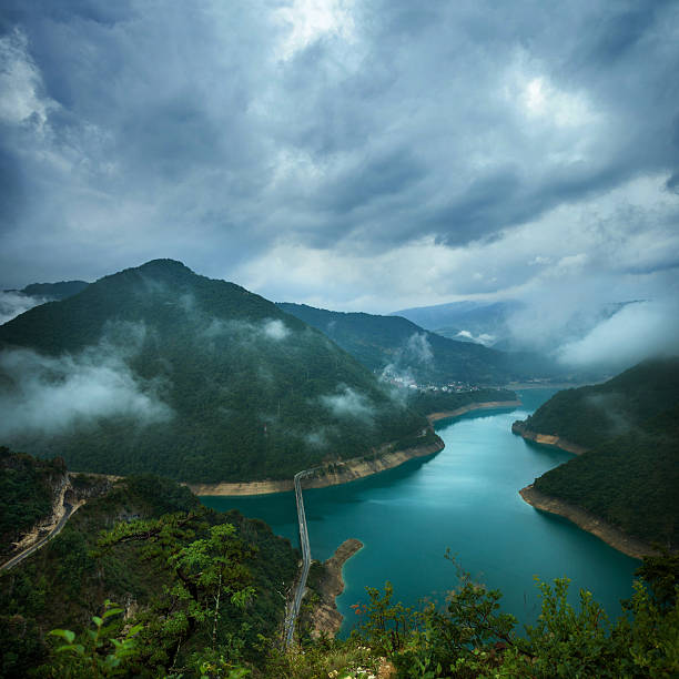 Lake in the mountains under the stormy sky