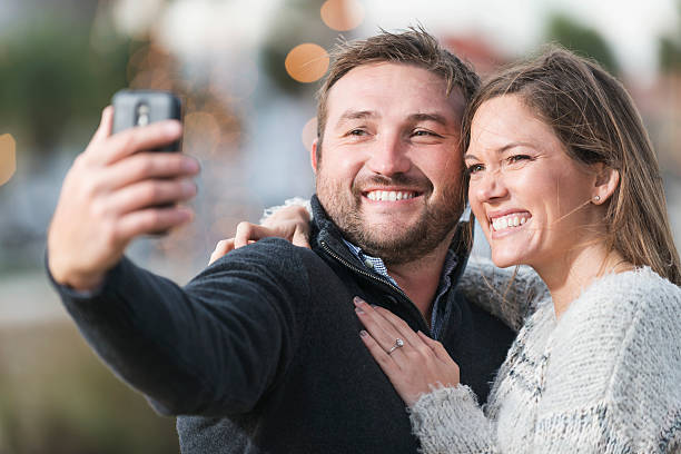 istock Happy couple taking selfie outdoors 487230042