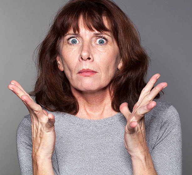istock tense senior woman expressing disillusion and exasperation 487234328