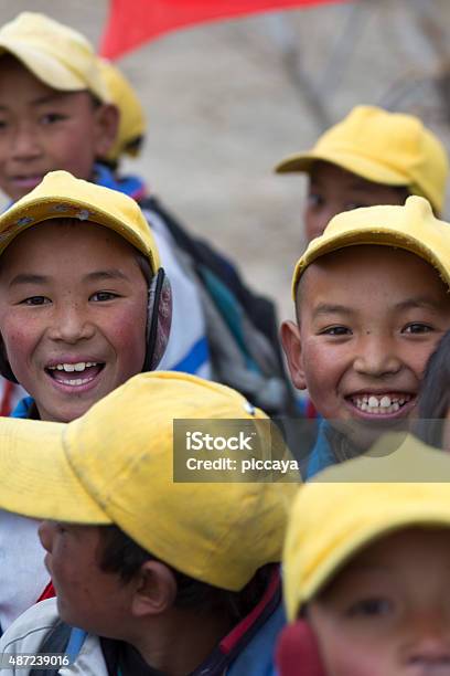 Kids Playing With A Red Flag In Tibet Stock Photo - Download Image Now - 2015, Asia, Asian and Indian Ethnicities