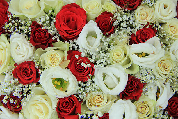 Red and white roses in a floral wedding centerpiece