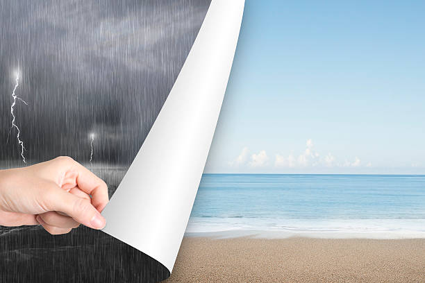 Woman hand open calm beach page replace stormy ocean stock photo