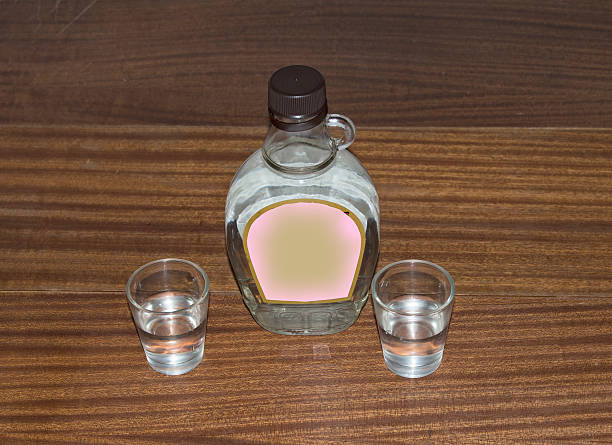 istock Small bottle of vodka and two glasses 487246760