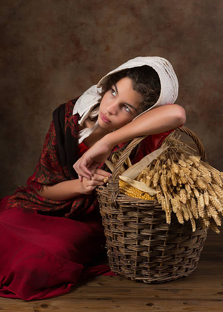 Reenactment image of a victorian peasant girl holding a basket