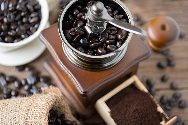 istock coffee beans in the bag and grinder. 487247198