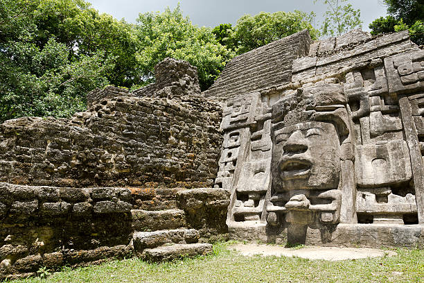 Temple in Belize Ancient Maya Mask Temple located in the jungle of Belize. maya temple stock pictures, royalty-free photos & images