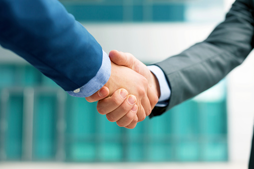 Business people shakeing hands, copy space