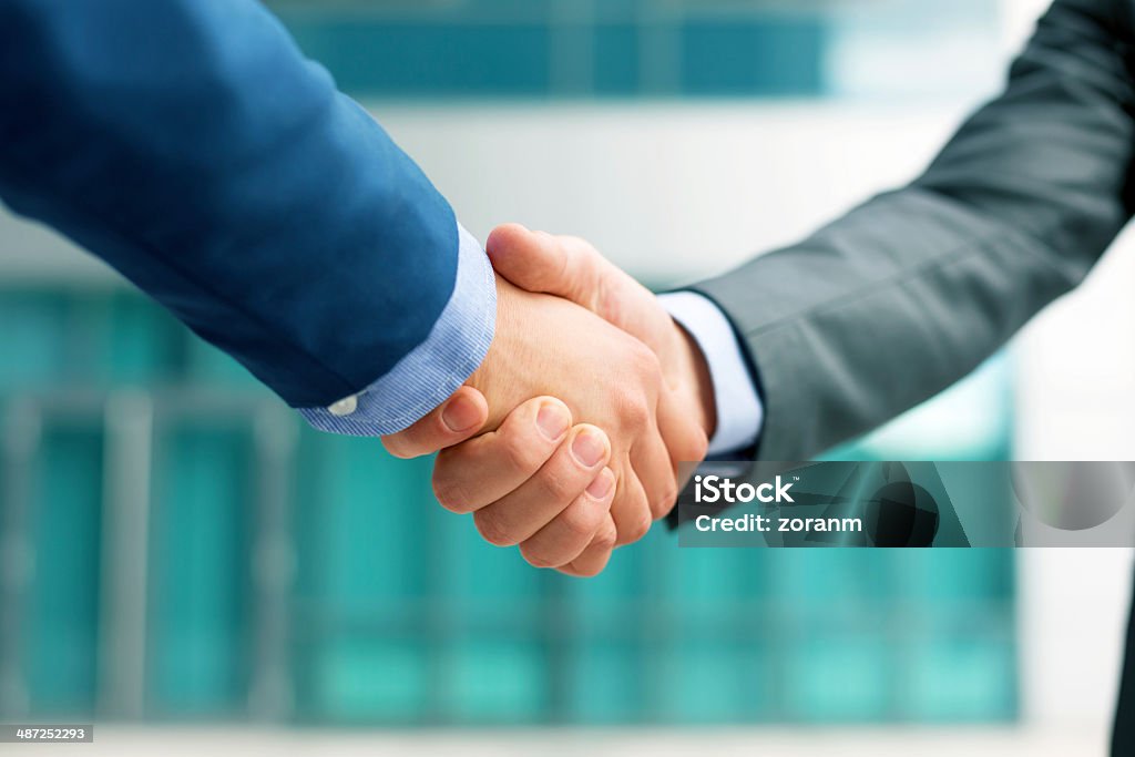 Handshake Business people shakeing hands, copy space Gripping Stock Photo