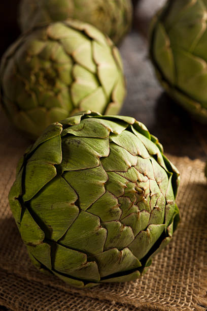 istock Raw Organic Artichokes on a Background 487252383