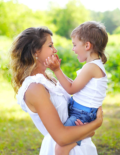 istock Mother with child son having fun outdoors in summer day 487253874