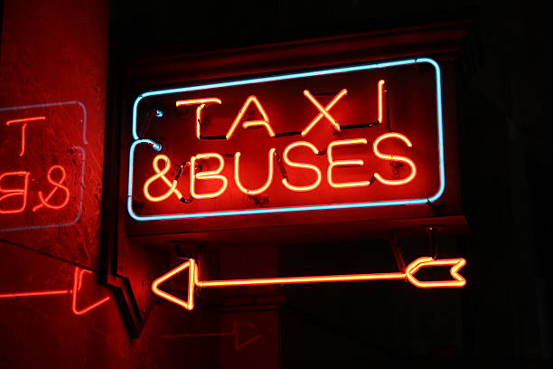 istock Neon Sign Taxi & Buses 487253997