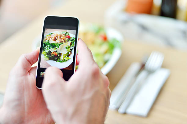istock Smartphone taking picture from salad 487254051