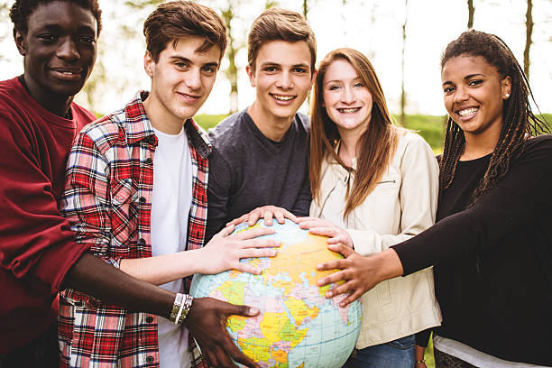 istock teenagers college student smiling with globe 487254069