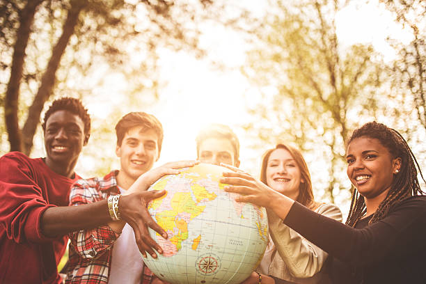 istock teenagers college student smiling with globe 487254099