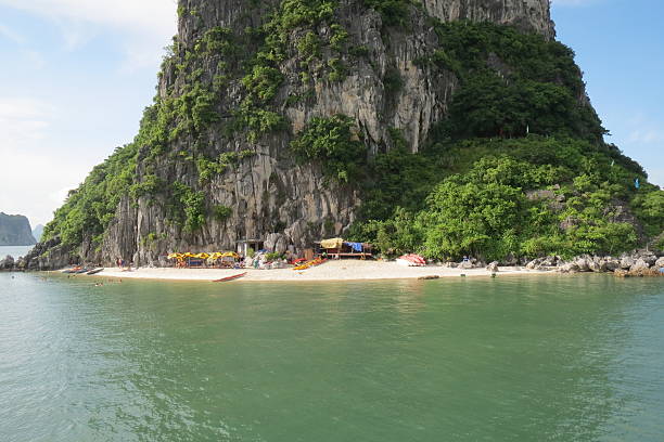 Beautiful island paradise at Halong Bay Vietnam. Swimming beach nestled in amongst hundreds of spectacular land forms.