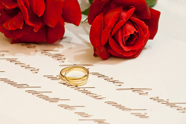 istock Wedding rings with vows and roses 487254401