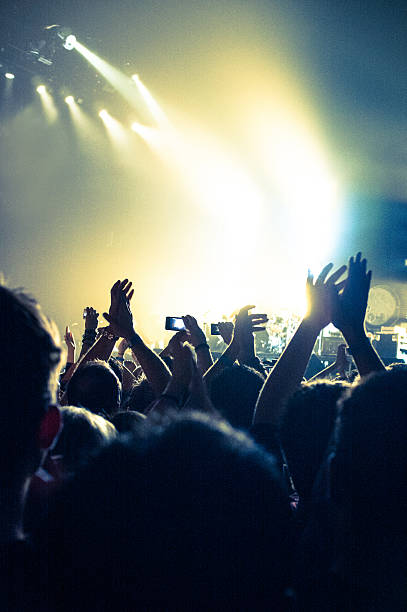istock Concert Lighting, arms in the air 487254969