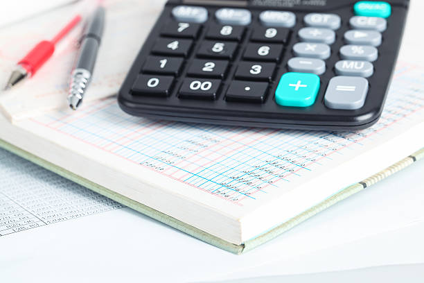 istock calculator and financial books 487255127