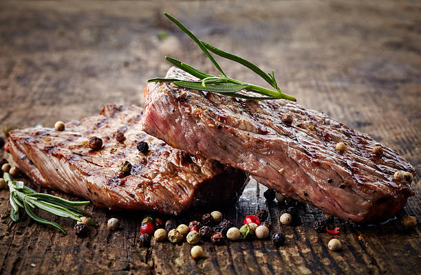 istock grilled beef steak on wooden cutting board 487255657