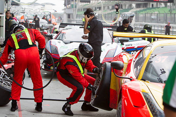 Asian Festival of Speed, GT Asia main race, Sepang Malaysia Sepang, Malaysia - September 5, 2015: Italian Ferrari Car No 37 changes tires at Asian Festival of Speed Race, Sepang, Malaysia. Car 37 won the race pitstop stock pictures, royalty-free photos & images