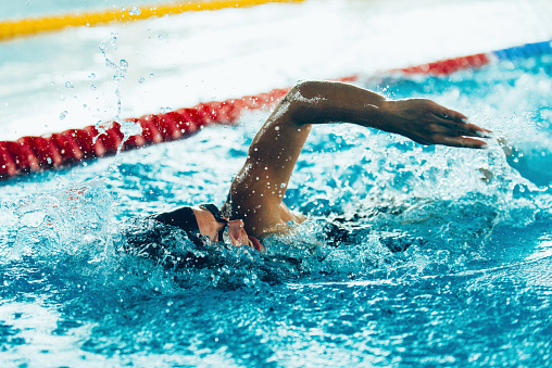 Freestyle swimming competitor in action