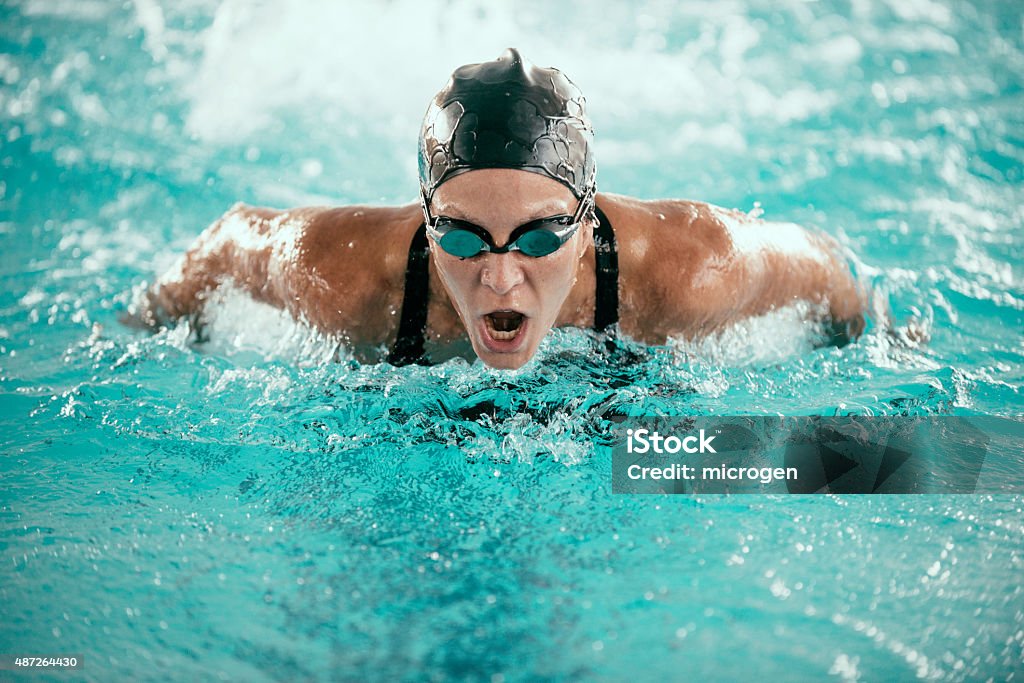 Butterfly Stroke Swimming Champion High speed action shot of a butterfly stroke swimming champion Sport Stock Photo