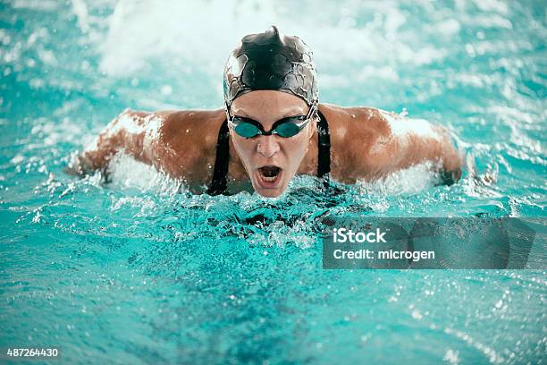 Butterfly Stroke Swimming Champion Stock Photo - Download Image Now - Sport, Swimming, Athlete