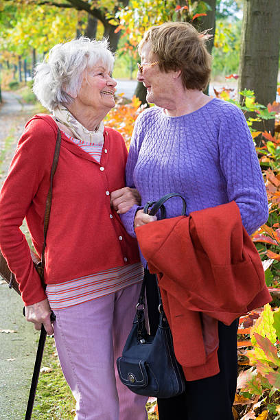 istock Two Senior Women Smiling to Each Other. 487267454