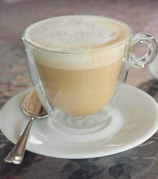 istock cup of cappuccino on the table in cafe. square crop 487270488