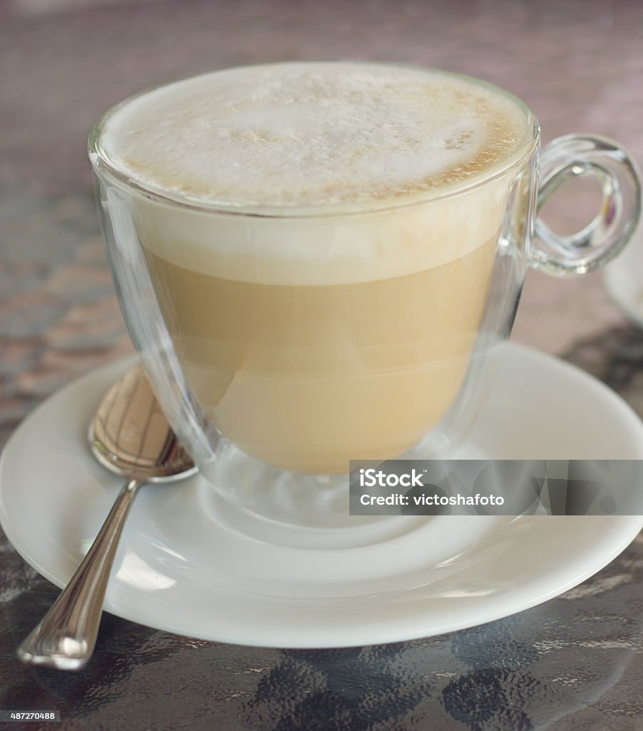 cup of cappuccino on the table in cafe. square crop cup of cappuccino on the table in a cafe. square crop 2015 Stock Photo