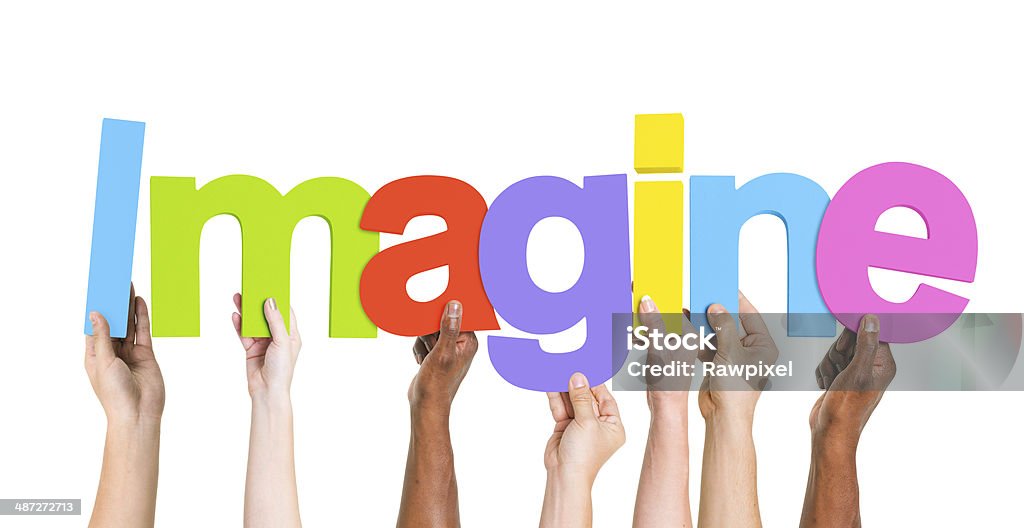 Groupe diversifié de mains tenant Imaginez - Photo de Brainstorming libre de droits