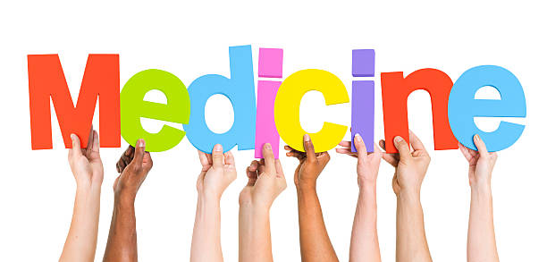 istock Diverse Group of Hands Holding Medicine 487272785