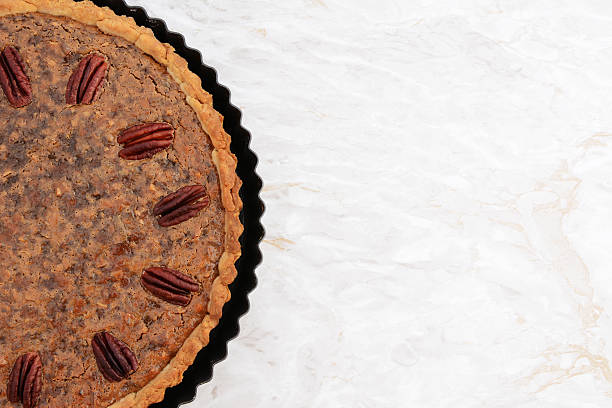 istock Freshly baked pecan pie in the baking tin 487274072