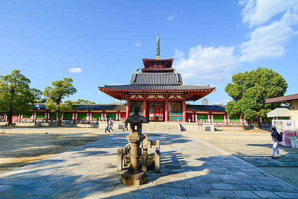 Shitennoji Temple in Osaka, Japan Osaka, Japan - October 28, 2014: People visit at Shitennoji Temple in Osaka, Japan. Constructed in 593, the temple is the first Buddhist and oldest officially administered temple in Japan. shitenno ji stock pictures, royalty-free photos & images